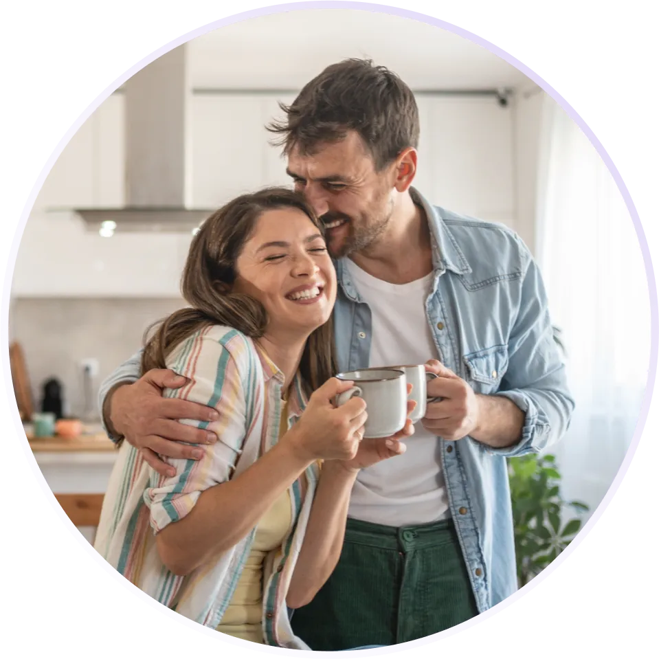 a man and a woman smiling and embracing